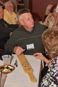 Ron Smith Signing 50th Paddle